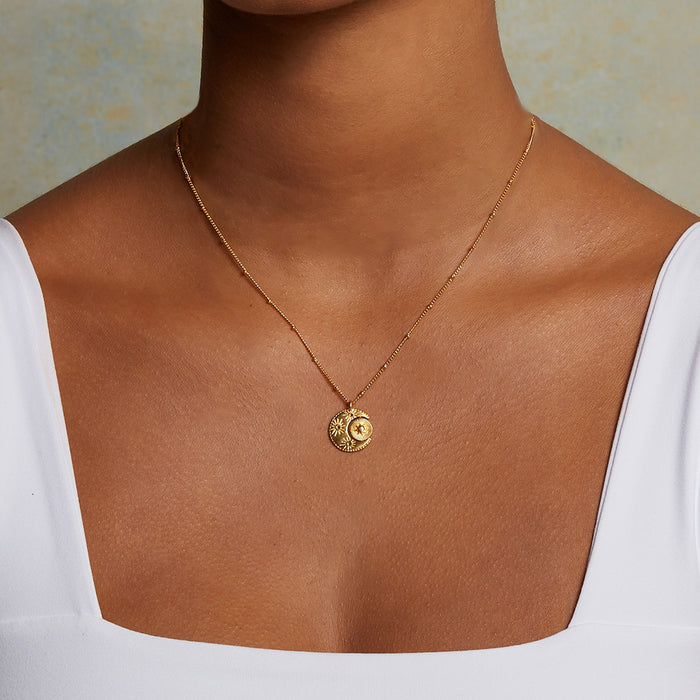 Close-up of the Sacred Realm Spinning Pendant Celestial Necklace highlighting the sun and moon motif, a beautiful piece of spiritual jewelry and talisman for those seeking vitality and inspiration.