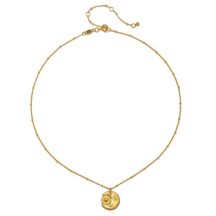 Studio image of the Sacred Realm Spinning Pendant Celestial Necklace on a delicate chain, symbolizing the connection of sun and moon, perfect for meditation and spiritual practices.