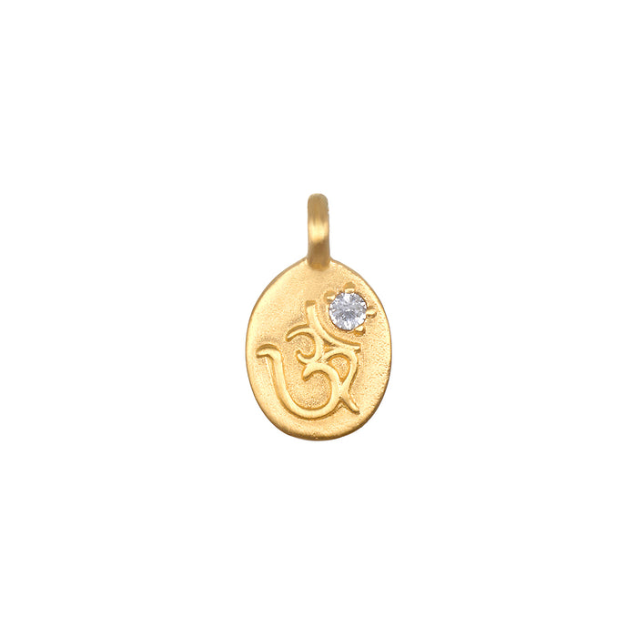 Sacred Sounds Om White Topaz Charm featuring a beautifully engraved Om symbol in 18kt gold plate, enhanced with a white topaz stone, perfect for spiritual jewelry, meditation, and as a meaningful charm for protection and manifestation.