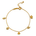 Gold-toned charm bracelet with delicate chain and five symbolic pendants set with white topaz stones.