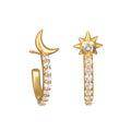 Scattered Stardust Celestial Moon and Star Pavé Hoop Earrings featuring shimmering pavé white topaz set in 18kt gold plating. This spiritual jewelry embodies the essence of protection, manifestation, and the energy of the sun and moon, perfect for meditation and yoga lovers.