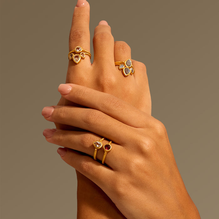 A stylish collection of rings including the Second Sight White Topaz Ring, highlighting its elegant design as part of a personalized ring stack, perfect for meditation and personal protection.