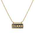 Self Evolution Moon Phase Necklace showcasing the beautiful moon phases on a gold-plated bar against a gunmetal background, perfect for spiritual jewelry and meditation, symbolizing protection and manifestation.