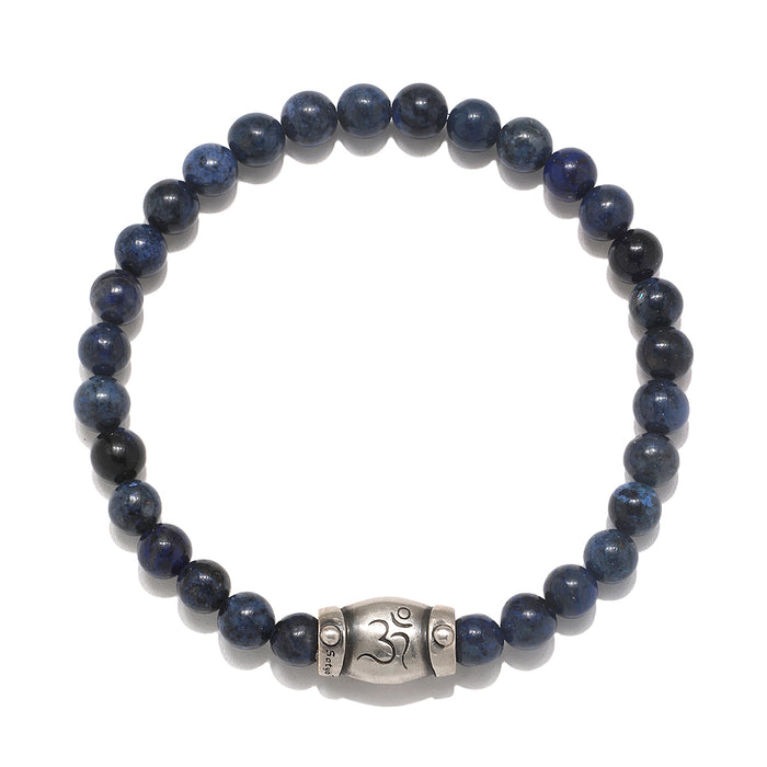 Self Knowledge Men's Dumortierite Bracelet in deep blue tones featuring a unique silver 'om' charm, ideal for spiritual jewelry and meditation practices. This talisman represents positivity, making it a meaningful addition to your zodiac or malas collection, perfect for protection during yoga and manifestation.