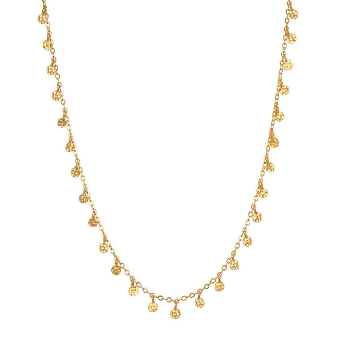 Shimmering Sky Choker Necklace featuring hammered golden discs that scatter light, symbolizing protection and manifestation, perfect for spiritual jewelry and yoga enthusiasts.