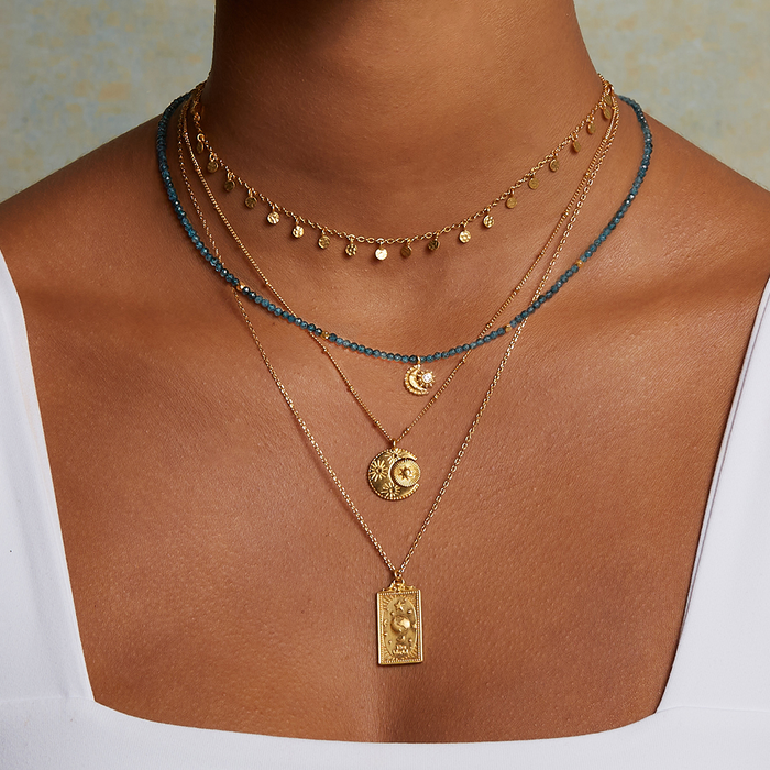 Dazzling look at the Shimmering Sky Choker Necklace layered with colorful accents, representing sun and moon energy in meaningful spiritual jewelry.