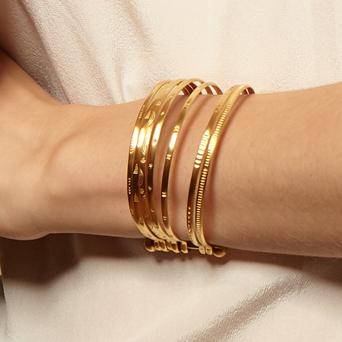 Small Gold Bangle Bracelet Cuff - Something Special worn on a wrist, showcasing its elegant design as part of spiritual jewelry, ideal for meditation gifts that are meaningful and protective amulets during yoga practice.