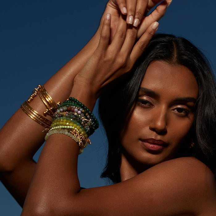 Small Gold Bangle Bracelet Cuff - Something Special adorned on an arm, beautifully layered with other bangles, representing the essence of spiritual jewelry, a perfect gift for meditation and sacred moments in one's journey.