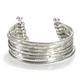 Small Silver Multi Bangle Cuff showcasing a stylish design, symbolizing spiritual jewelry and meaningful adornment, perfect as a meditation gift or for yoga practices. This cuff, with its protective and sacred elements, embodies the essence of manifestation and hamsa symbolism.