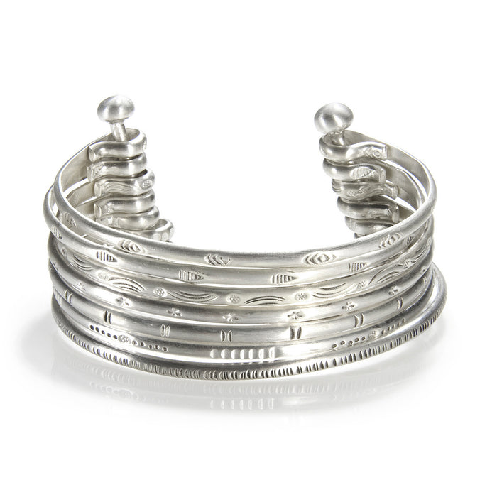 Small Silver Multi Bangle Cuff showcasing a stylish design, symbolizing spiritual jewelry and meaningful adornment, perfect as a meditation gift or for yoga practices. This cuff, with its protective and sacred elements, embodies the essence of manifestation and hamsa symbolism.