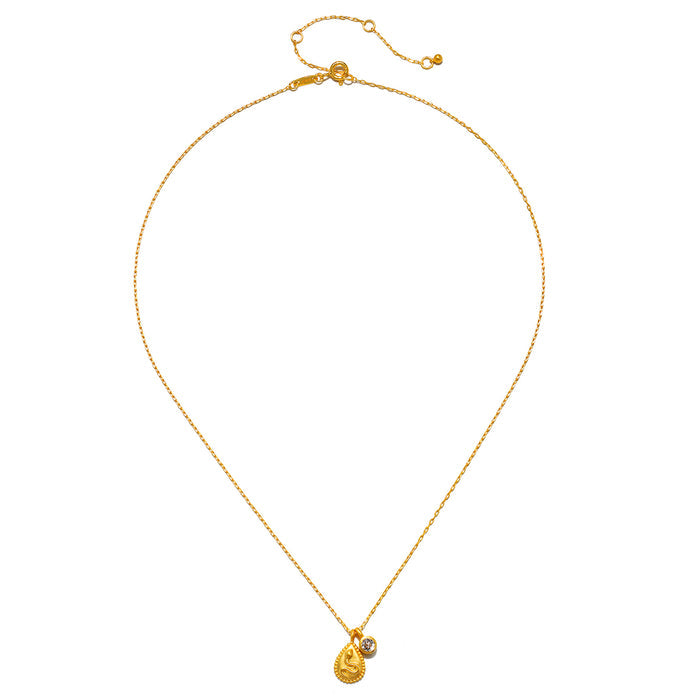 Gold-toned snake pendant necklace with adjustable chain and clear crystal accent on pendant.