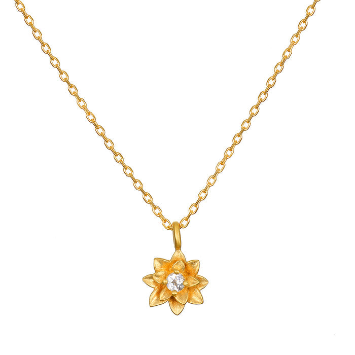 Soul Renew Gold Lotus Necklace featuring a beautiful 18kt gold plated lotus flower charm with a white topaz accent. This spiritual jewelry piece symbolizes new beginnings and is perfect for meditation and manifestation, making it a meaningful talisman for yoga and holistic practices.