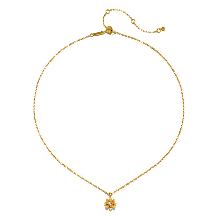 The Soul Renew Gold Lotus Necklace displayed on a white background, highlighting its elegant design of a lotus charm with a white topaz stone. This spiritual jewelry symbolizes manifestation and serves as a talisman for those seeking spiritual alignment and meaningful experiences in their lives.