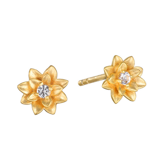 Soul Renewal Gold Lotus Earrings displayed beautifully, featuring a lotus flower design with a sparkling white topaz, symbolizing new beginnings and full potential, perfect for those who appreciate spiritual jewelry and seek meaningful accessories for meditation and manifestation.