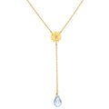 Speak with Strength Chakra Lariat Necklace featuring a golden flower motif and a blue topaz drop, symbolizing communication and honesty in spiritual jewelry and meditation, ideal for yoga and meaningful manifestation.