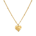 Spirit of Love Gold Heart Necklace featuring a delicate 18k gold plated heart pendant with elegant scrollwork, perfect for wearing during meditation or as a talisman for spiritual meaning and manifestation.