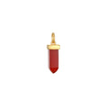 Stay Grounded Red Onyx Dagger Charm featuring a striking red onyx crystal set in an 18kt gold plate. This spiritual jewelry piece symbolizes endurance and protection, perfect for meditation and manifestation practices. Ideal for yoga enthusiasts, this talisman embodies meaning and connection with the sun and moon.
