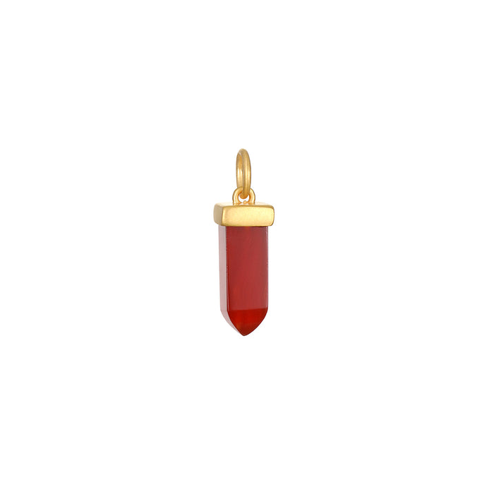 Stay Grounded Red Onyx Dagger Charm featuring a striking red onyx crystal set in an 18kt gold plate. This spiritual jewelry piece symbolizes endurance and protection, perfect for meditation and manifestation practices. Ideal for yoga enthusiasts, this talisman embodies meaning and connection with the sun and moon.