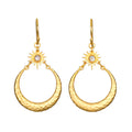 Stellar Sisterhood Moonstone Hoops featuring hammered 18kt gold plate and moonstone accents, embodying spiritual jewelry for those seeking protection and guidance in their meditation and yoga practices. These meaningful earrings symbolize the connection between sun and moon, enhancing manifestation and zodiac energy.