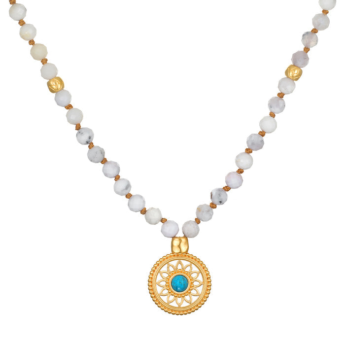 Step Into Self White Opal Mandala Mala featuring 108 white opal beads and an 18kt gold plated mandala pendant with turquoise, ideal for spiritual jewelry and meditation practices. This talisman embodies the meaning of protection and manifestation, perfect for yoga enthusiasts.