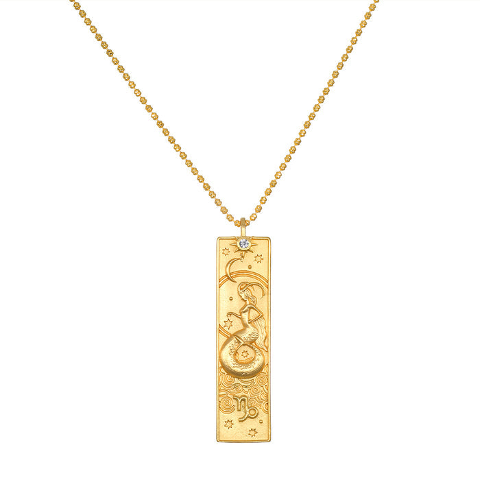Story of Capricorn Zodiac Necklace featuring an 18kt gold plated pendant with intricate designs, embodying the essence of spiritual jewelry and a talisman for manifestation, perfect for meditation and yoga enthusiasts.