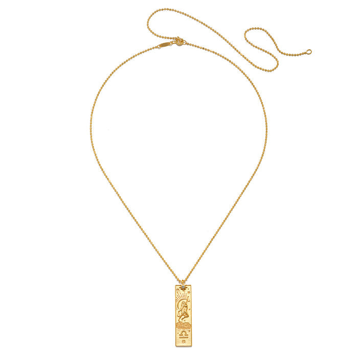 Story of Libra Zodiac Necklace showcasing a delicate design in 18kt gold plating, adorned with a white topaz gemstone symbolizing individuality and creativity, perfect for spiritual jewelry, meditation, and as a talisman for harmony. This piece reflects the zodiac's meaningful connection to the sun, moon, and personal manifestation.