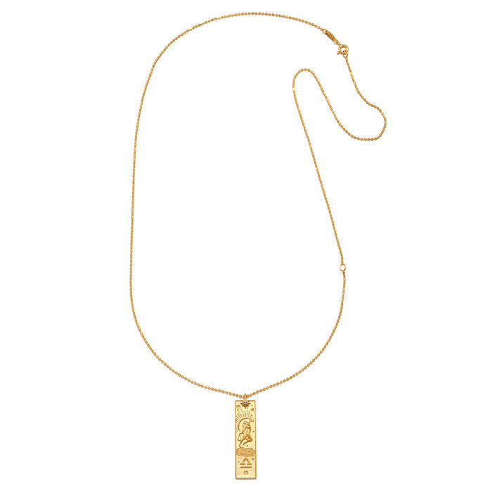 Story of Libra Zodiac Necklace displayed elegantly, featuring a gold-plated pendant that embodies the essence of the Libra zodiac, with a focus on protection and balance, ideal for yoga practice and spiritual exploration. Its design resonates with the meanings of zodiac signs and personal growth.