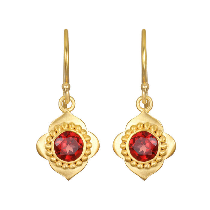 Strong Heart Garnet Drop Earrings featuring elegant 18kt gold plating and a vibrant red garnet accent. This spiritual jewelry symbolizes new beginnings and offers grounding energy, perfect for meditation and meaningful moments. Ideal for yoga practitioners and those embracing manifestation.