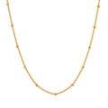 Subtle Beauty Dot Chain Choker displayed on a white background, showcasing its elegant design featuring golden dots. This spiritual jewelry piece is perfect for meditation and reflects a meaningful connection to the sun and moon.