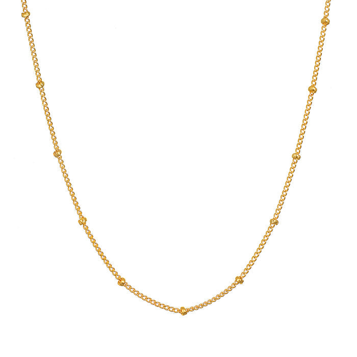 Subtle Beauty Dot Chain Choker displayed on a white background, showcasing its elegant design featuring golden dots. This spiritual jewelry piece is perfect for meditation and reflects a meaningful connection to the sun and moon.