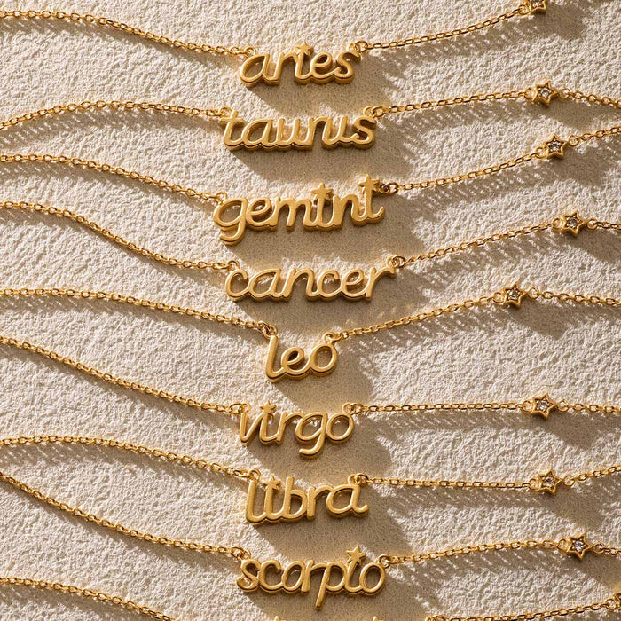 A collection of zodiac script necklaces including the Taurus Stability Zodiac Script Necklace, a beautiful piece of spiritual jewelry for those who embrace meditation and meaningful talismans.