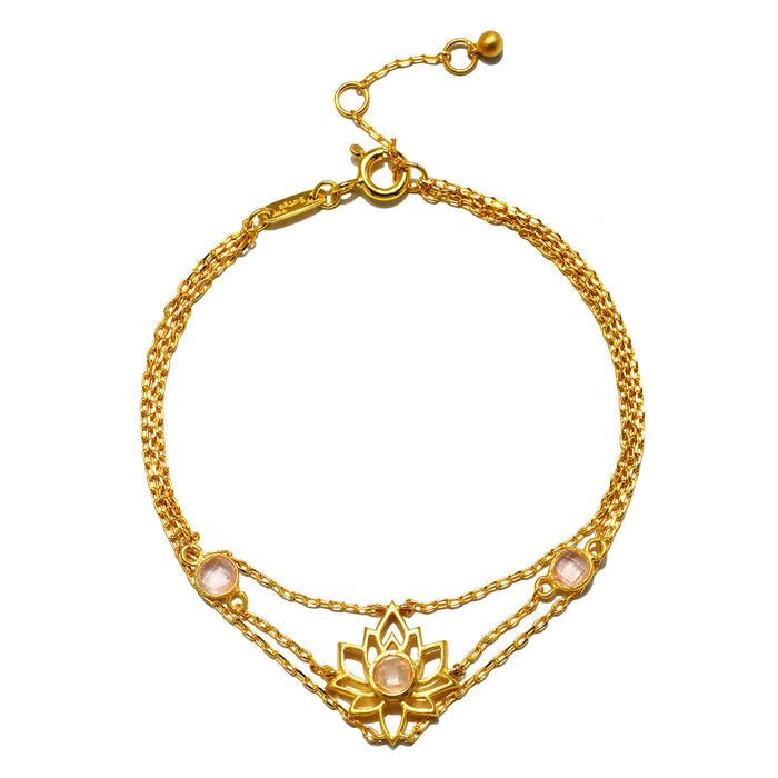 Transformed by Love Lotus Bracelet featuring an 18kt gold plate design adorned with a beautiful lotus flower and rose quartz stones. This spiritual jewelry piece symbolizes new beginnings and love, making it perfect for meditation and manifestation practices. Ideal as a meaningful talisman for protection and connection to sun, moon, and yoga energies.