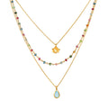 Transformed by Love Tourmaline Agate Lotus Triple Necklace showcasing a delicate design with colorful tourmaline and blue agate stones, perfect for spiritual jewelry enthusiasts seeking meaningful adornments for meditation, yoga, and manifestation.