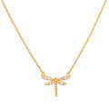 Gold-toned dragonfly pendant with white crystal accents on a delicate chain necklace.