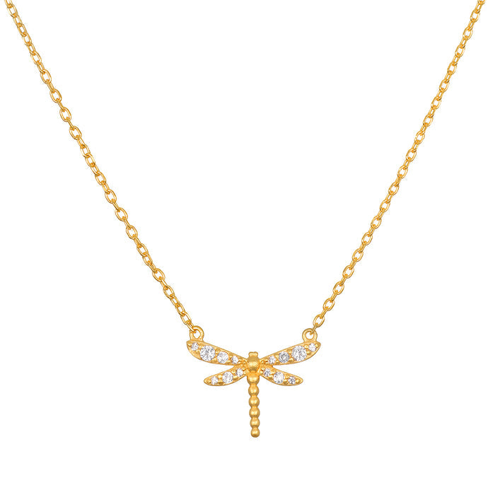 Gold-toned dragonfly pendant with white crystal accents on a delicate chain necklace.