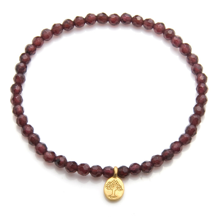 Tree of Life Garnet Gemstone Bracelet showcasing faceted garnet stones, symbolizing love and guidance. Perfect as spiritual jewelry for meditation gifts, this bracelet carries deep meaning and serves as a protective amulet for yoga and manifestation.