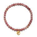Stretch bracelet with pink rhodonite beads and gold-toned moon-shaped charm pendant.