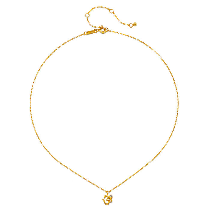 The Universal Connection White Topaz Om Necklace displayed flat, revealing its delicate 18kt gold plate design. This talisman symbolizes zodiac energies and is a cherished piece for those interested in spiritual jewelry, enhancing meditation and providing meaningful protection.