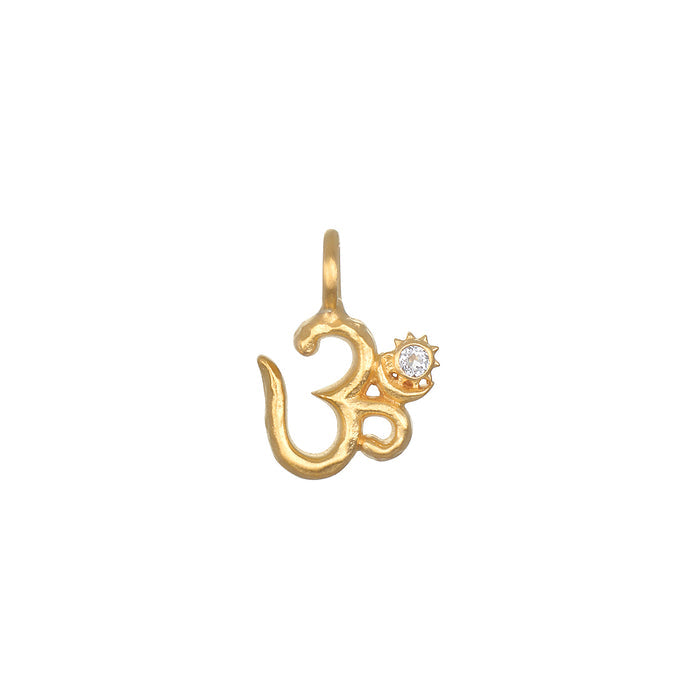 Universal Om White Topaz Charm featuring an openwork Om design, crafted in 18kt gold plate with a white topaz accent. This spiritual jewelry piece symbolizes individuality and creativity, making it a perfect talisman for meditation and yoga practice, enhancing personal manifestation and meaning.