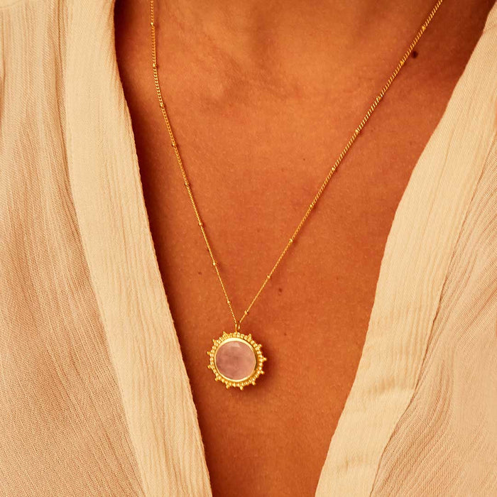 A relaxed look at the Unlimited Compassion Rose Quartz Gemstone Necklace, worn elegantly, embodying spiritual significance and protection, making it a wonderful addition to any soulful collection, especially for those into wellness and meditation.