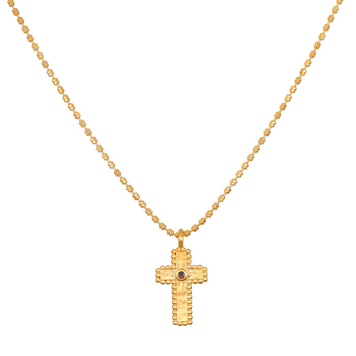 Unwavering Faith Garnet Cross Necklace featuring an 18kt gold plated cross, symbolizing spiritual jewelry for meditation and protection, complemented by tiny golden beads and a garnet stone, perfect for yoga and manifestation practices.