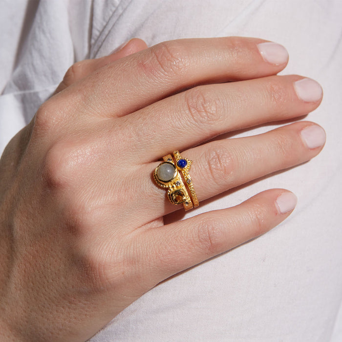The Vibrant Beauty Cluster Gemstone Ring Set elegantly displayed on a hand, highlighting the unique gemstones. This spiritual adornment serves as a talisman for self-awareness and meaning, ideal for harnessing positive energy in meditation and yoga.