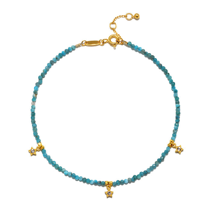 Walk Confidently Blue Moonstone Anklet featuring a delicate design of blue opal beads, 18k gold plated accents, and white topaz stars, embodying spiritual jewelry for meditation and manifestation of dreams, symbolizing the moon's protective energy and enhancing creativity in yoga practices.