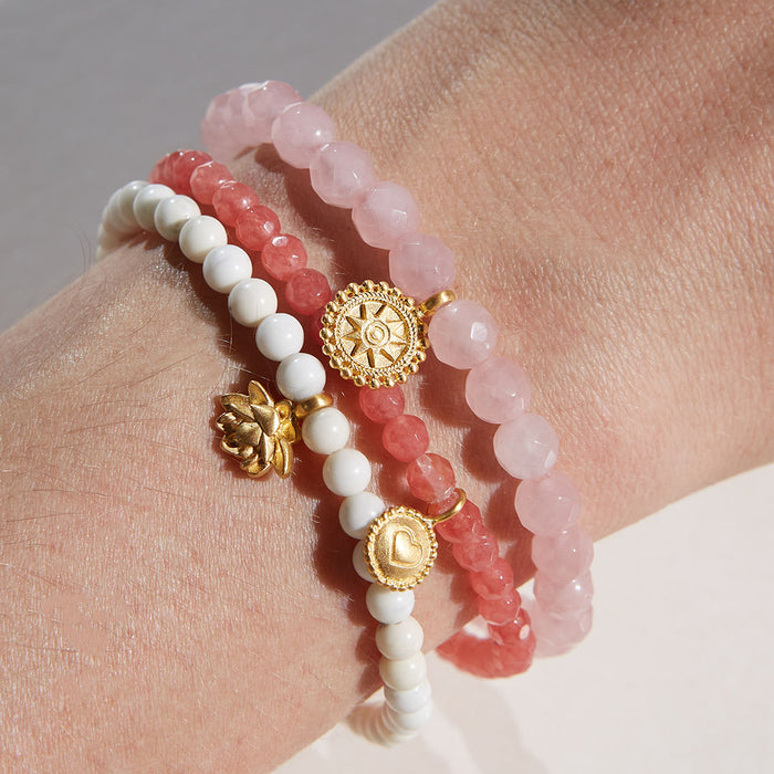 Walk in Harmony Lotus White Turquoise Gemstone Bracelet showcasing a delicate golden lotus flower, perfect for spiritual jewelry and meditation. This meaningful piece enhances balance, health, and self-expression, while also serving as a talisman for protection and manifestation in yoga practices.