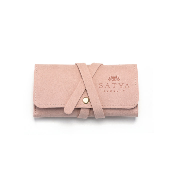 Weekend Journey Travel Jewelry Wrap Holder Pink, elegantly designed for spiritual jewelry. Made from soft microfiber, this holder protects your meaningful talismans like zodiac malas, providing a sense of yoga-inspired protection and manifestation while you travel.