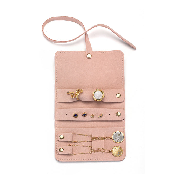 Interior view of the Weekend Journey Travel Jewelry Wrap Holder Pink, showcasing compartments for earrings, rings, and necklaces. This stylish wrap is perfect for keeping your spiritual jewelry organized and ensures your meaningful accessories are protected on your journey.