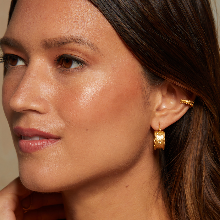 Model showcasing Whimsical Spirit White Topaz Bold Hoop Earrings, with a soft glow, emphasizing their connection to spirituality and style, ideal for yoga and personal manifestation.