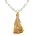 Wisdom Lotus Pearl Gemstone Mala with a golden tassel, perfect for spiritual jewelry and meditation, serving as a talisman for protection and manifestation, symbolizing the sun and moon and enhancing your yoga practice.