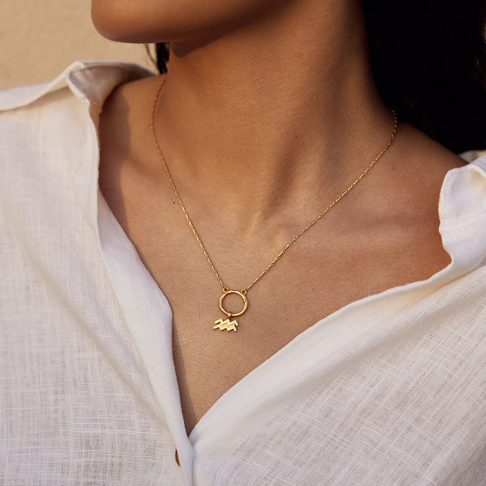 Close-up of a Zodiac Glyph Charm necklace showcasing the Aquarius glyph, perfect for those who value spiritual connection and meaningful symbols in their jewelry collection. Ideal for meditation and manifestation.